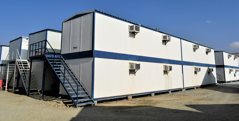Two-storey portable cabins arranged on a construction site to maximise space and functionality.