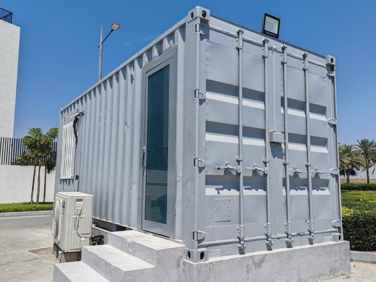 Grey construction site office cabin on a work site.