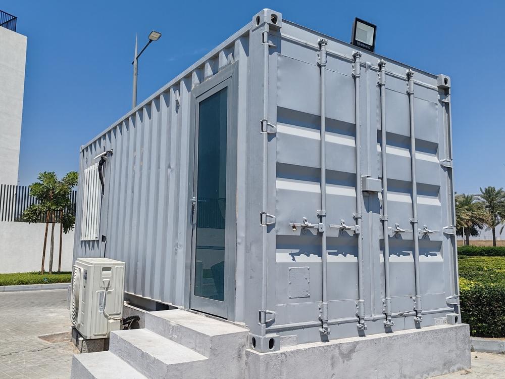 Grey construction site office cabin on a work site.